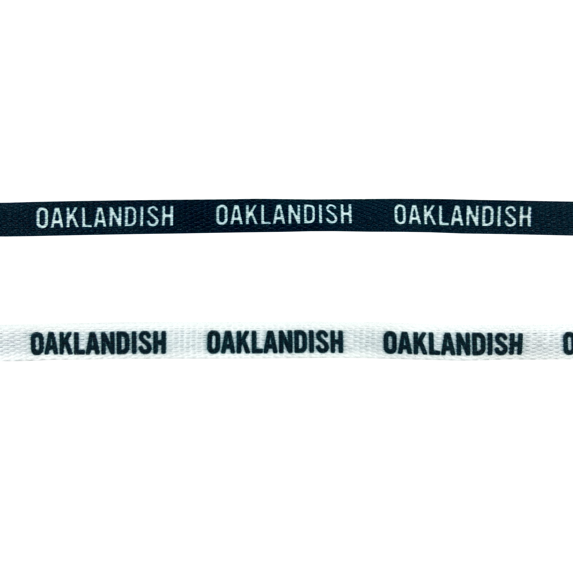 Two shoelaces one white and one black with OAKLANDISH wordmark on repeat.