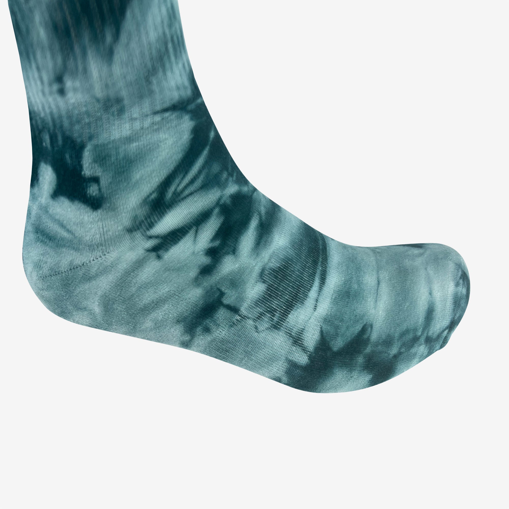 Close up of foot wearing a high-cut light and dark blue crew sock.