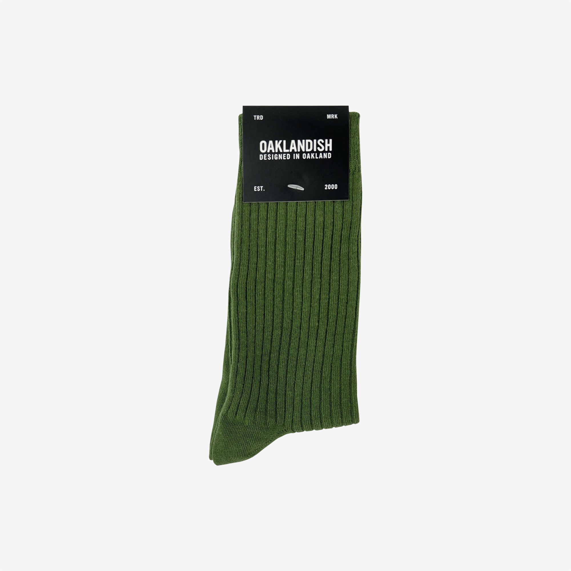 Green high cut men's crew socks in folded Oaklandish retail packaging.