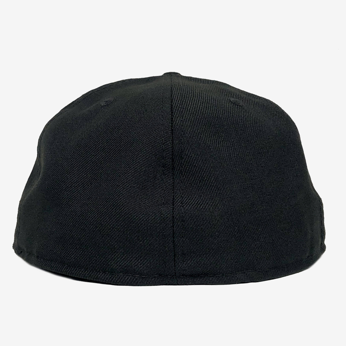 The image shows the back view of a New Era OAK 59FIFTY Fitted Cap by Oaklandish. The cap features a simple, classic design with no visible logos, text, or designs. It has a plain black color, likely made from cotton or a similar fabric that gives it a smooth texture. The background is plain white, which emphasizes the cap's solid black hue.