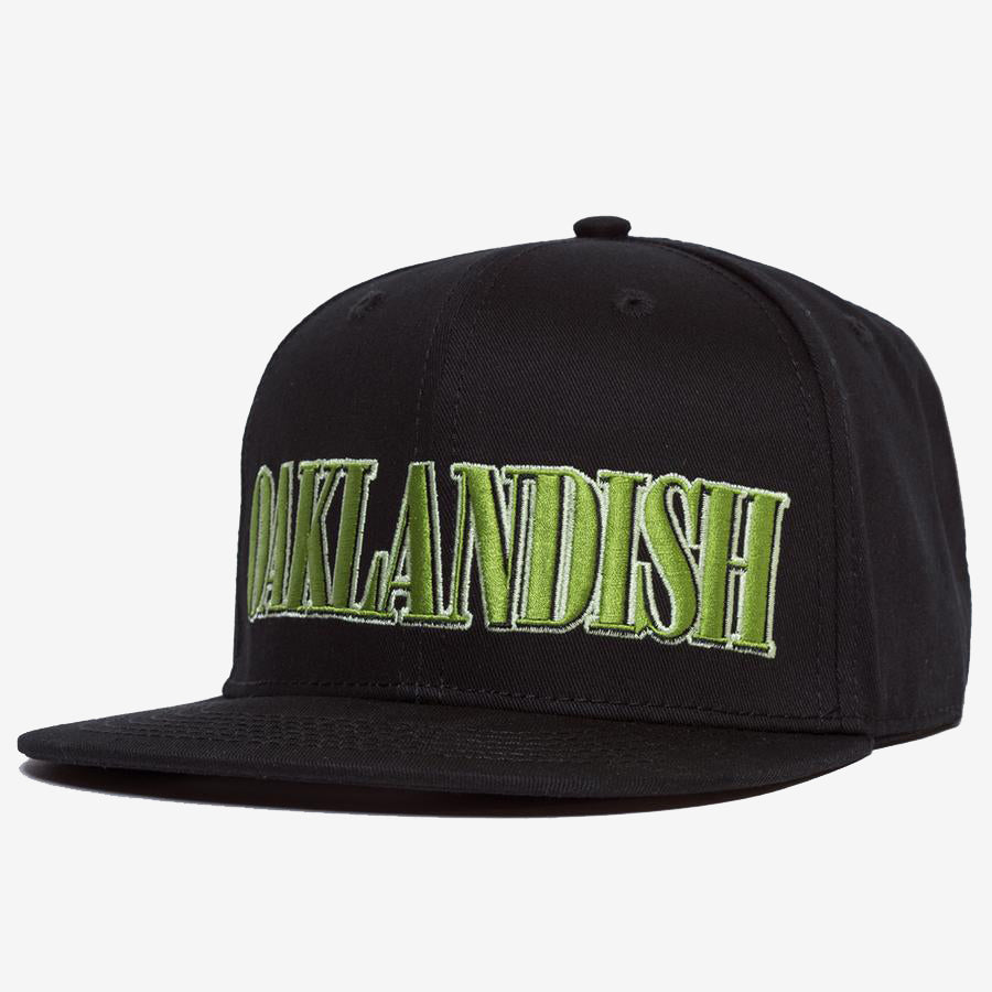 Black snapback cap with green embroidered Oaklandish tree logo on the front. 