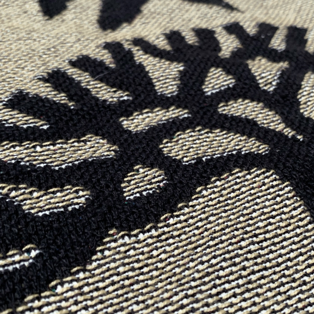 Detailed close up of throw blanket - viva oakland - black and gold -100% cotton