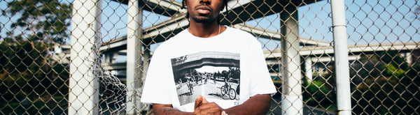 Ant wearing tee with black and white photo of bikers.