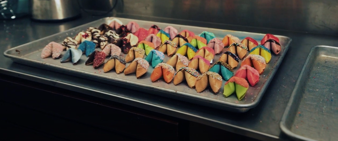 A tray of colorful fortune cookies.