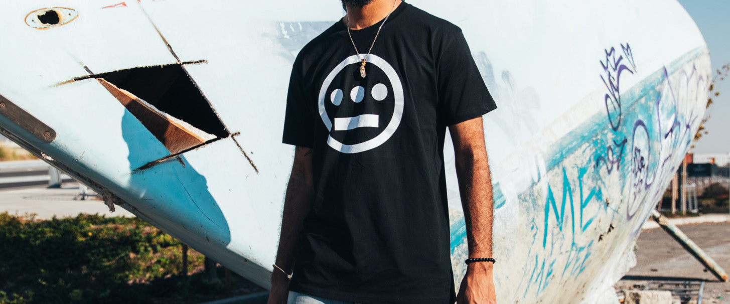 Man wearing black tee with Hieroglyphics logo.