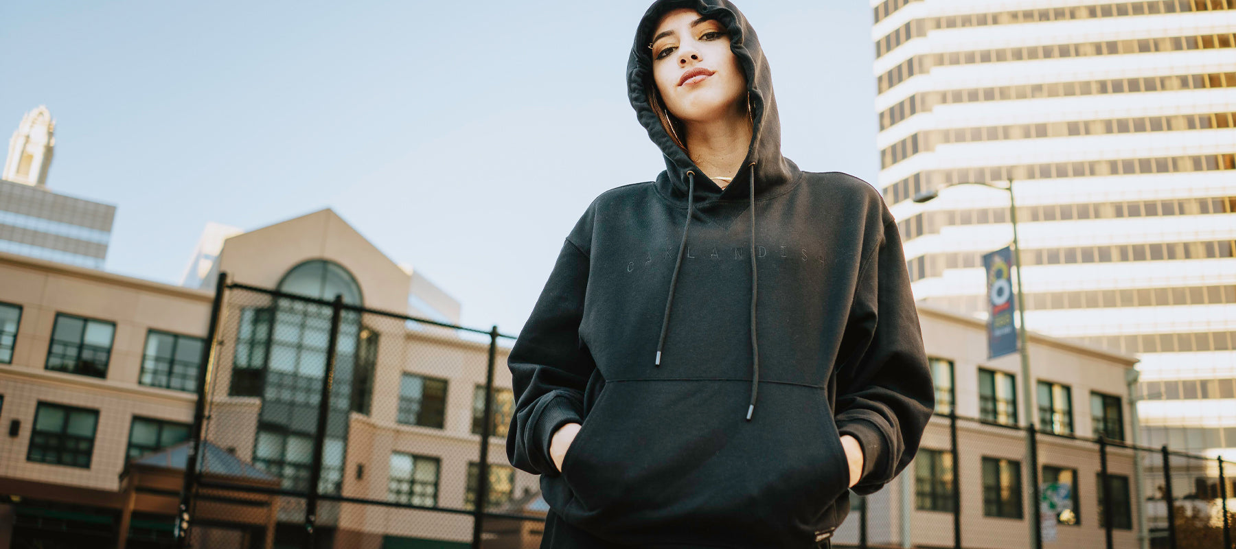Woman modeling Oaklandish standard hoodie.