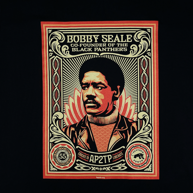 Close-up of the large illustrated graphic by Shepard Fairey, founder of the Black Panthers, on women’s black limited edition t-shirt. 