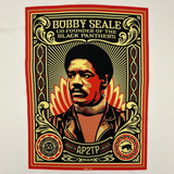 Close-up of the large illustrated multi-colored graphic by Shepard Fairey, founder of Black Panthers, on a natural cotton-colored t-shirt.