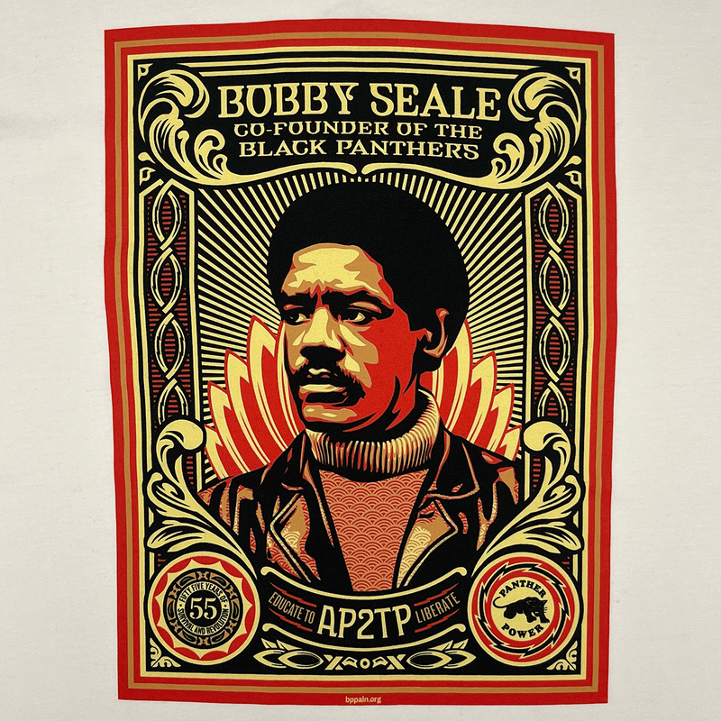 Close-up of the large illustrated multi-colored graphic by Shepard Fairey, founder of Black Panthers, on a natural cotton-colored t-shirt.