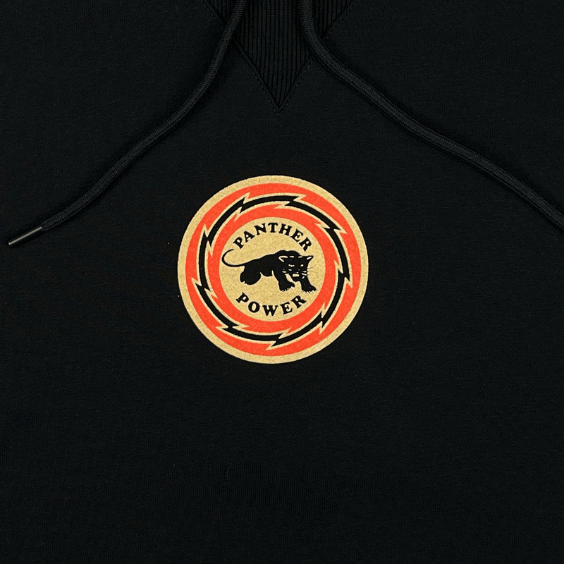 Close-up of Panther Power circle graphic on the front of black limited edition collectors hoodie.
