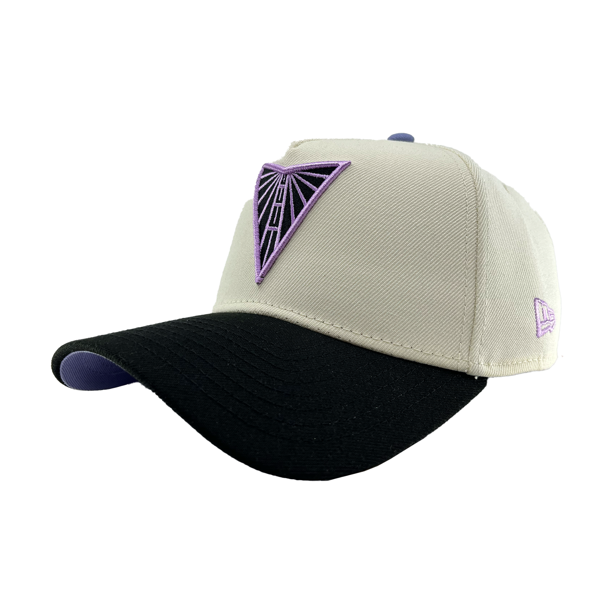 The GSV 9FORTY AF 2 Tone snapback by GSV features a cream crown, black curved brim, purple embroidered triangle logo, purple underside, and a small side logo—ideal for Golden State Valkyries fans.
