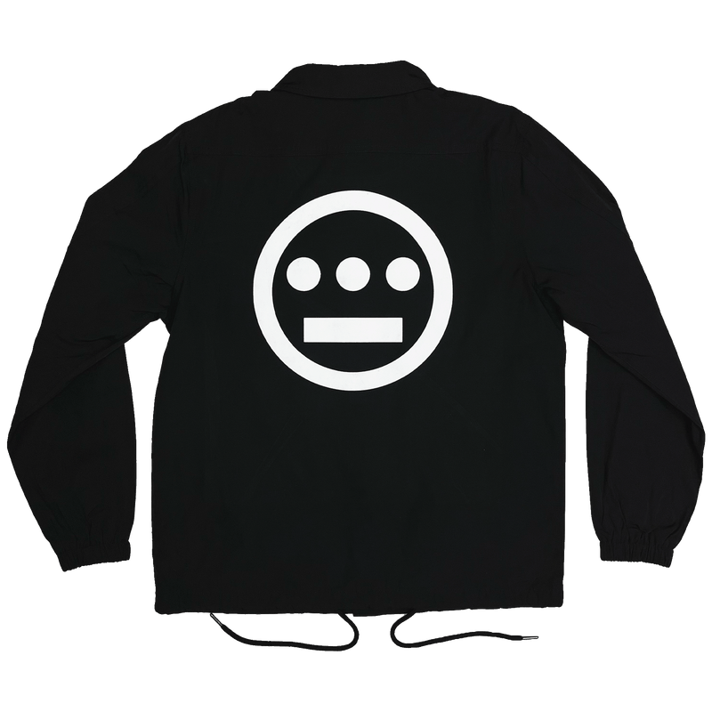 Back side of black coaches jacket with waist strings with Hiero logo printed in white ink.