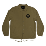 Khaki coaches jacket with snap closure, collar, and drawstring waist and Hiero logo printed in black ink on front left chest.