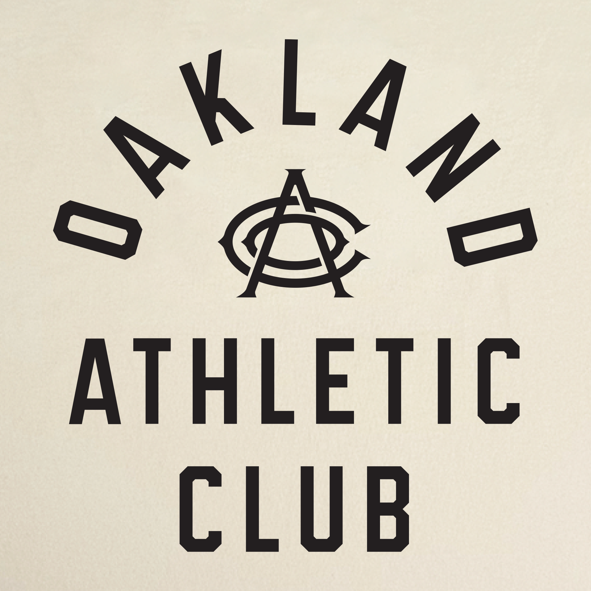 Text reads “OAKLAND ATHLETIC CLUB” in bold black letters, with “OAKLAND” arched above a stylized overlapping “OAC” monogram and “ATHLETIC CLUB” stacked below. This design appears on the OAC Prestigious Tee—a classic fit t-shirt crafted from soft, heavyweight cotton. The background is a light beige.
