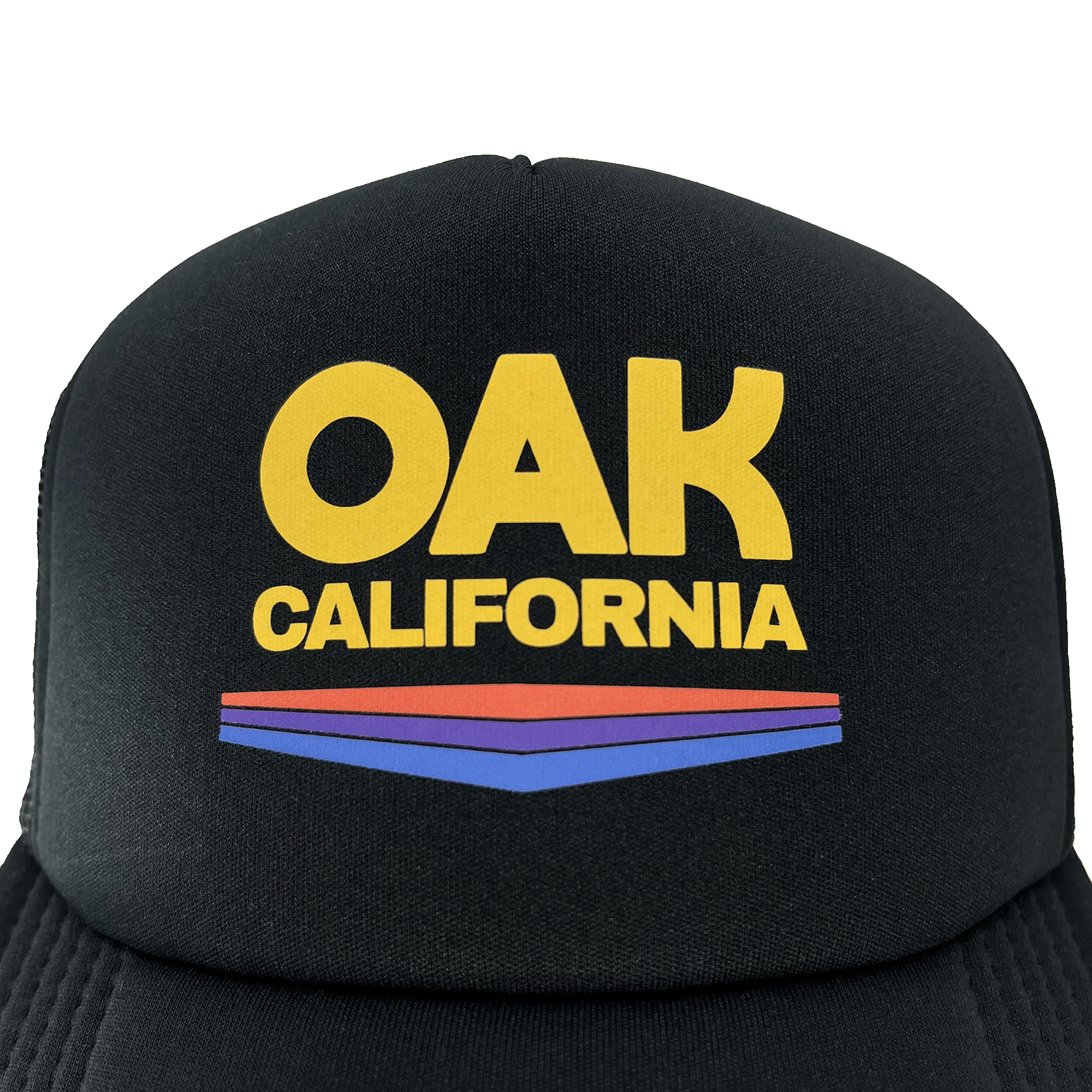 Close-up of Oak California graphic on front foam panel of a black Oaklandish trucker cap.