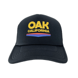Front view of black truckers cap with color Oak California graphic on front foam panel with curved brim.