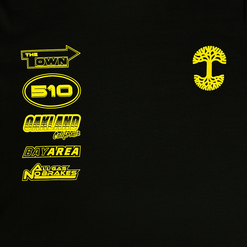 Detail close up of black long sleeve t-shirt with yellow racecar-inspired design on front and sleeves.