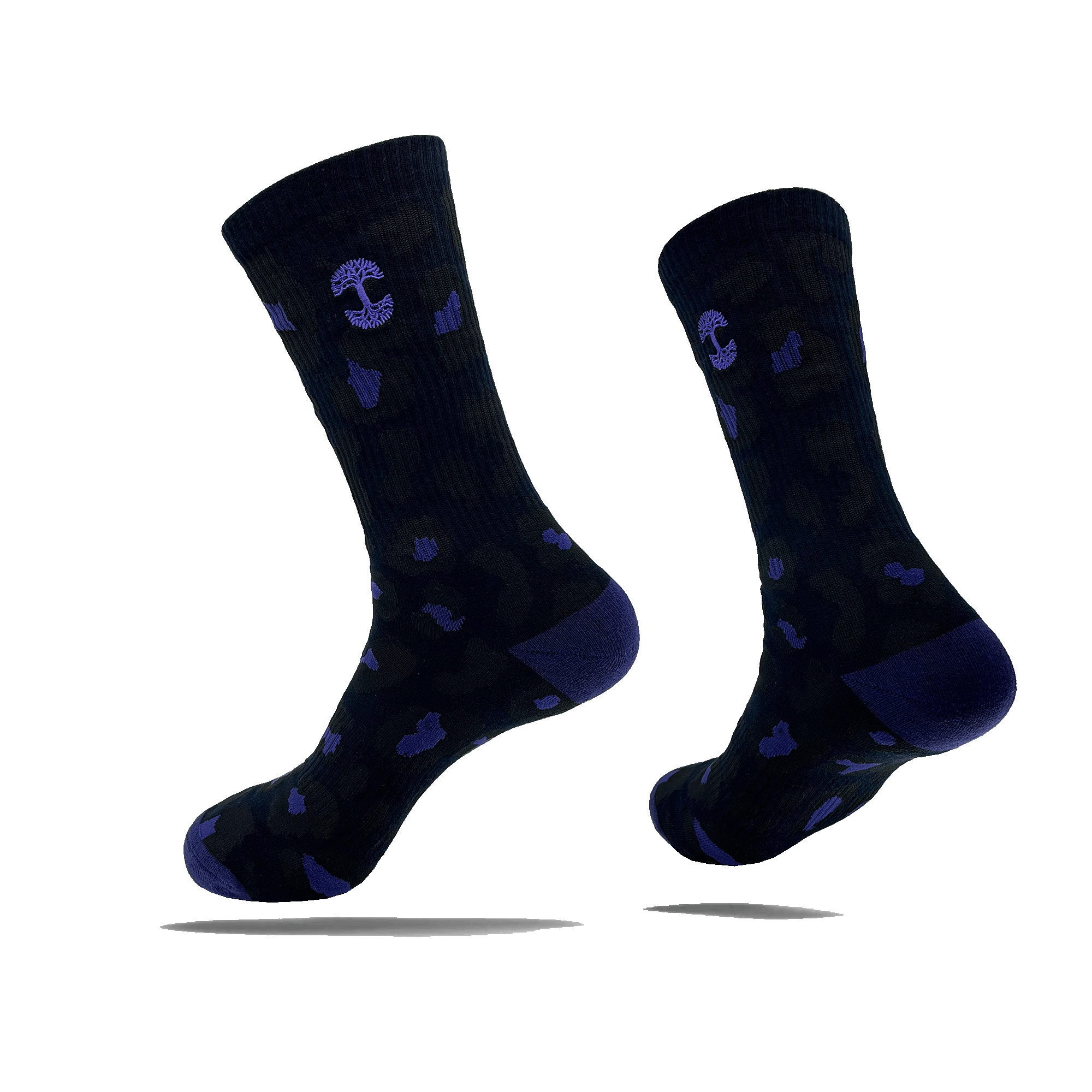 Side view of black crew socks with a small blue Oaklandish tree logo on the side calves and blue splotches.