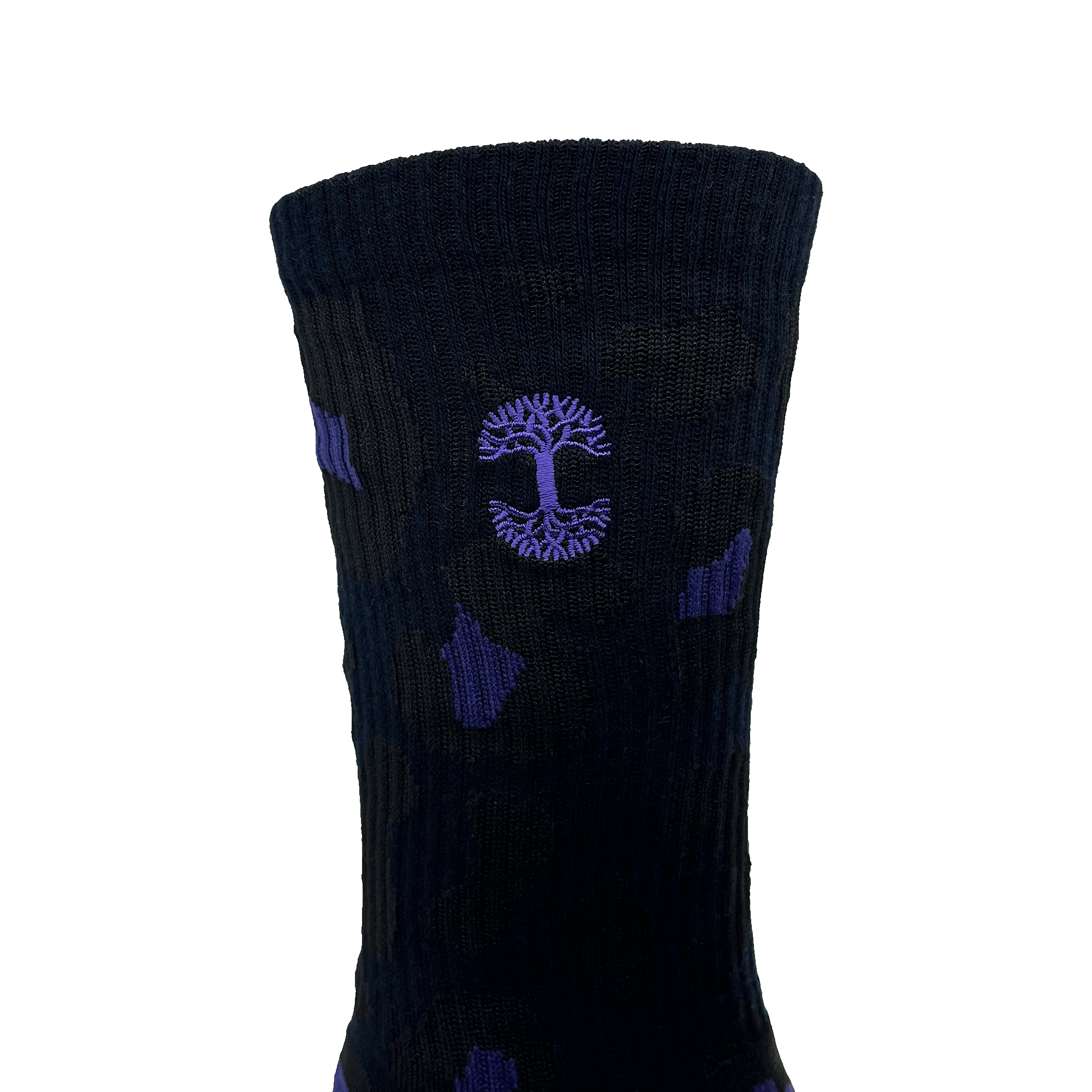 Close-up of embroidered small blue Oaklandish tree logo on the side of black and blue crew sock.