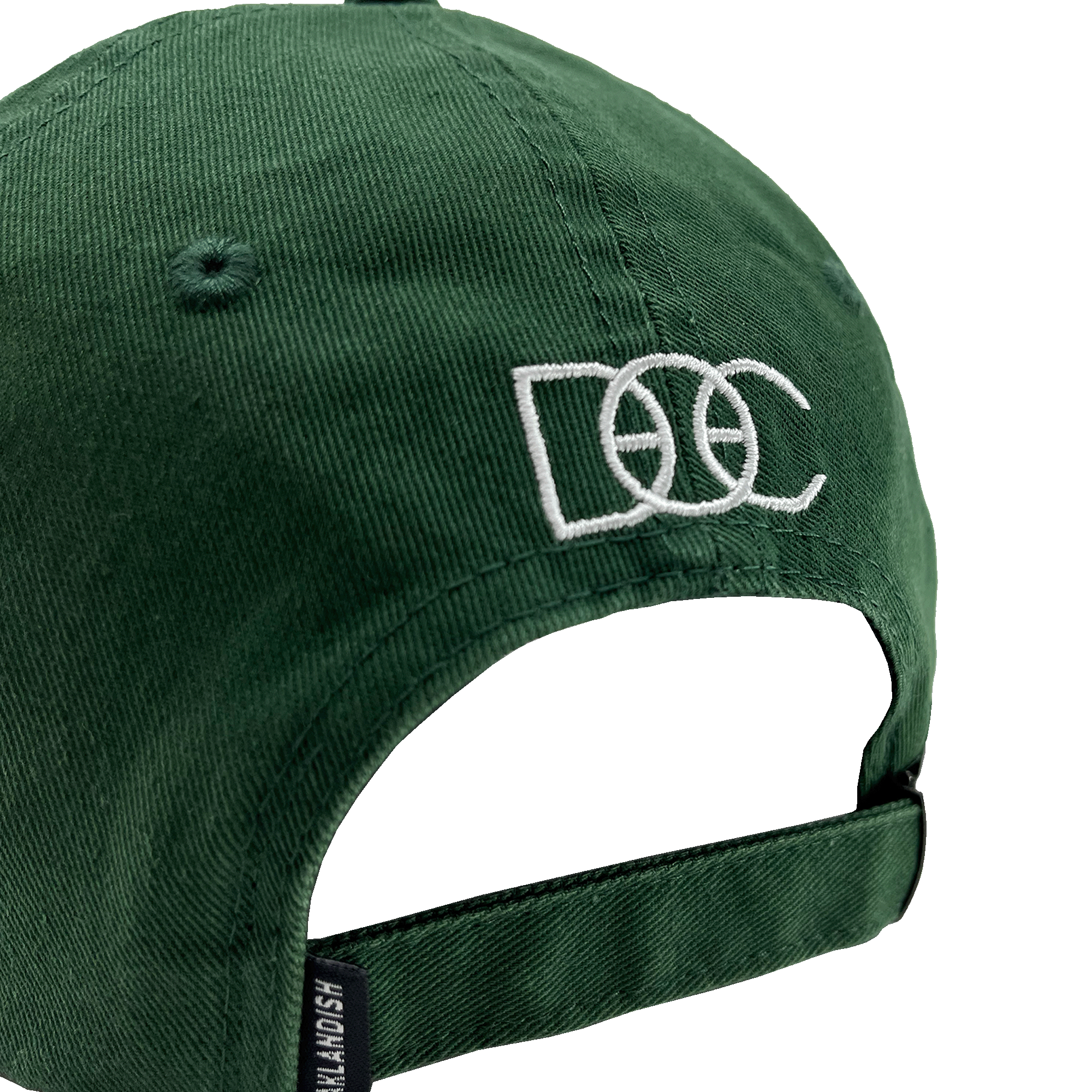The Happy Oakland Dad Hat by Oaklandish is displayed from the back, showcasing a green corduroy fabric with an adjustable strap and a silver buckle. The back is embroidered with the letters "DCC" in white, featuring a basketball design integrated into the middle "C," reflecting Bay Area culture.