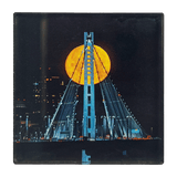 Image of full moon over Oakland's Bay Bridge by photographer Vincent James.
