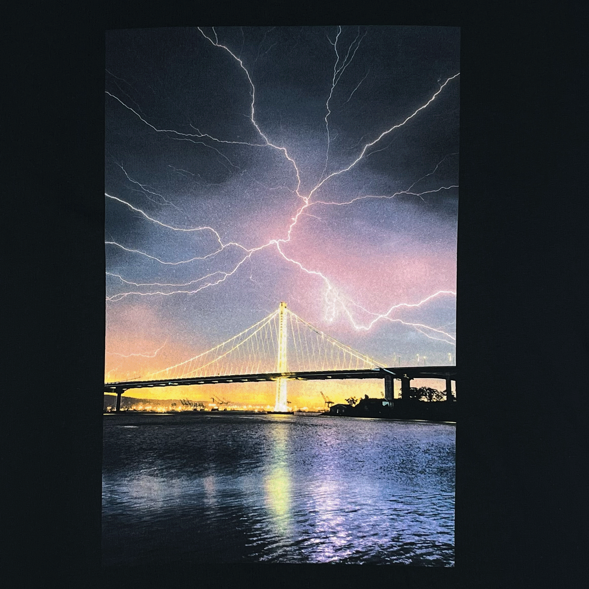 Close up of lightning and bay bridge by Vincent James on black t-shirt.