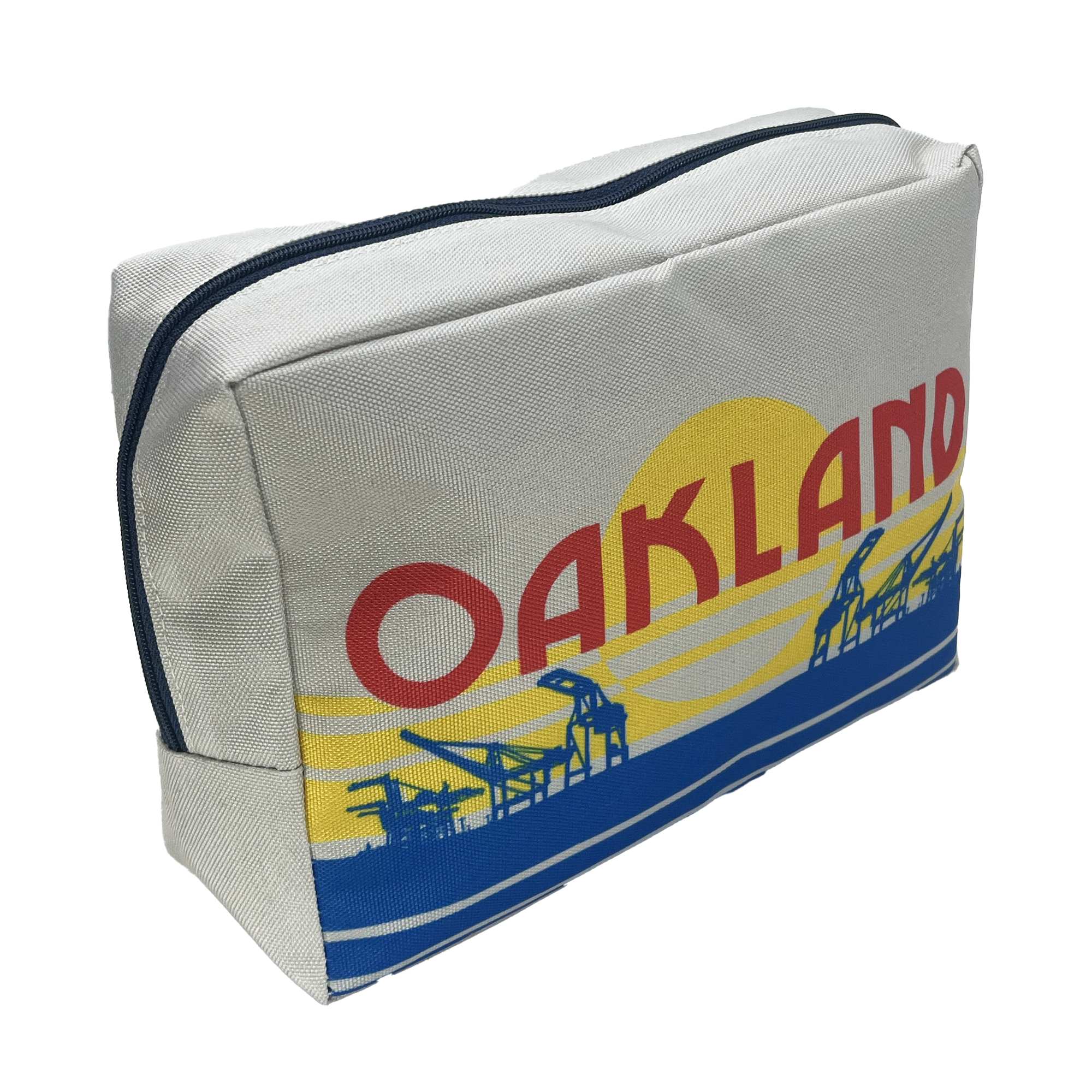 Angled view of a zippered polyester travel pouch with a red, blue, and yellow license plate design features an OAKLAND wordmark and graphic crane.
