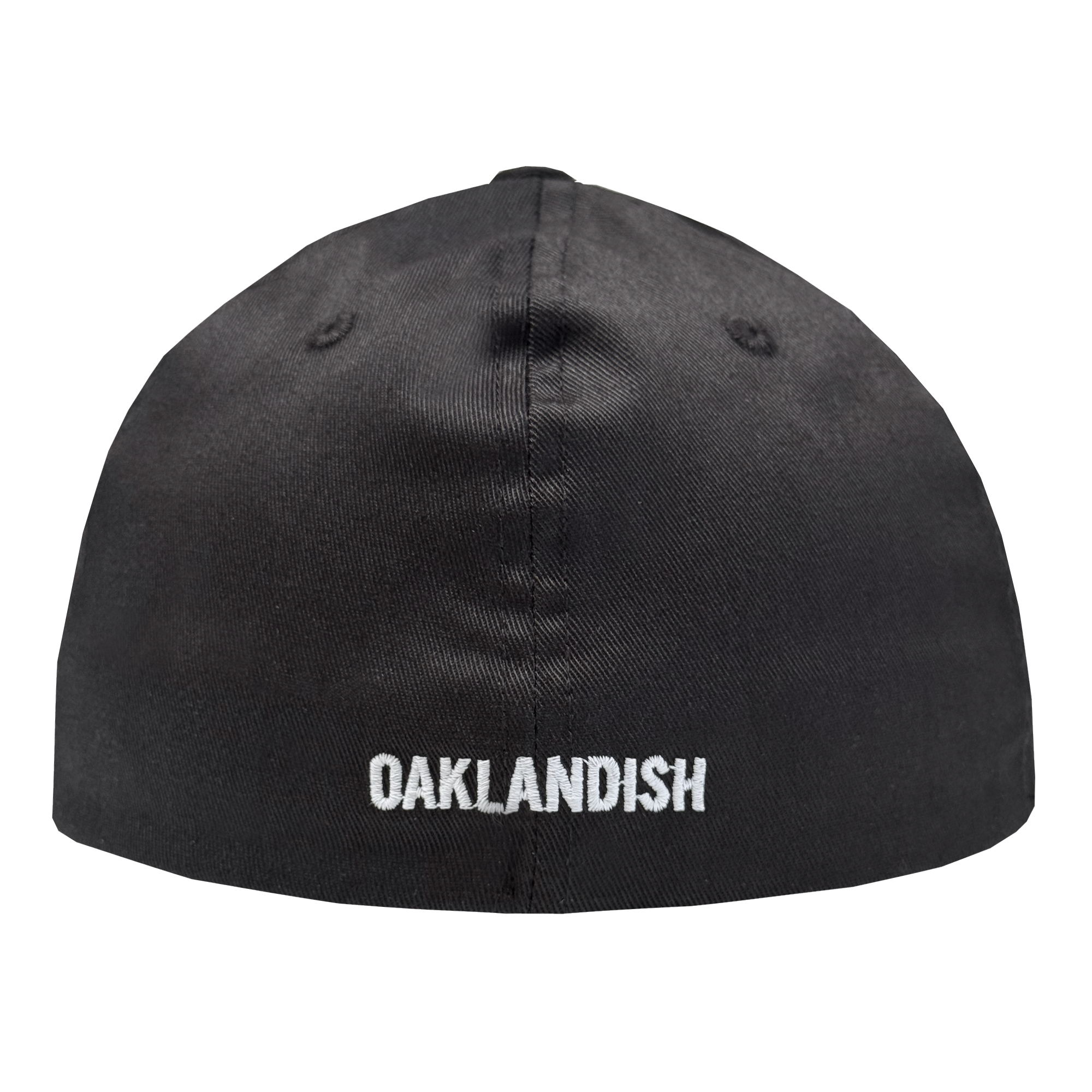 The Oakland Ballers Flexfit Cap by Oakland Ballers is a black fitted cap, shown from the back, with "OAKLANDISH" embroidered in white all-caps near the bottom edge and two stitched ventilation eyelets on each side of the top seam.