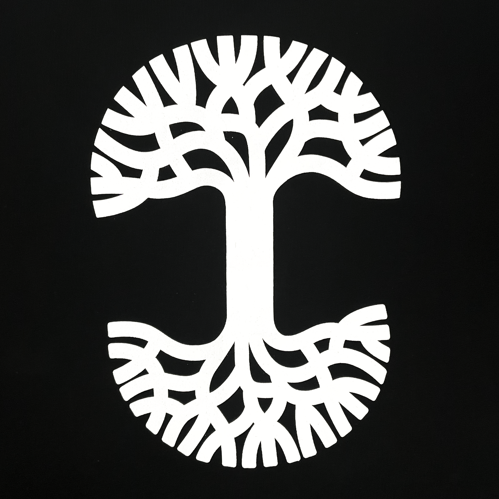 The Oaklandish Heavy Button-up Baseball Jersey features a stylized white, symmetrical tree design on a black background. This Oaklandish logo showcases interwoven branches and roots, forming a circular shape. The mirrored branches at the top and roots at the bottom symbolize balance and unity. Available in men's sizing, this sleek baseball jersey embodies both style and meaning.