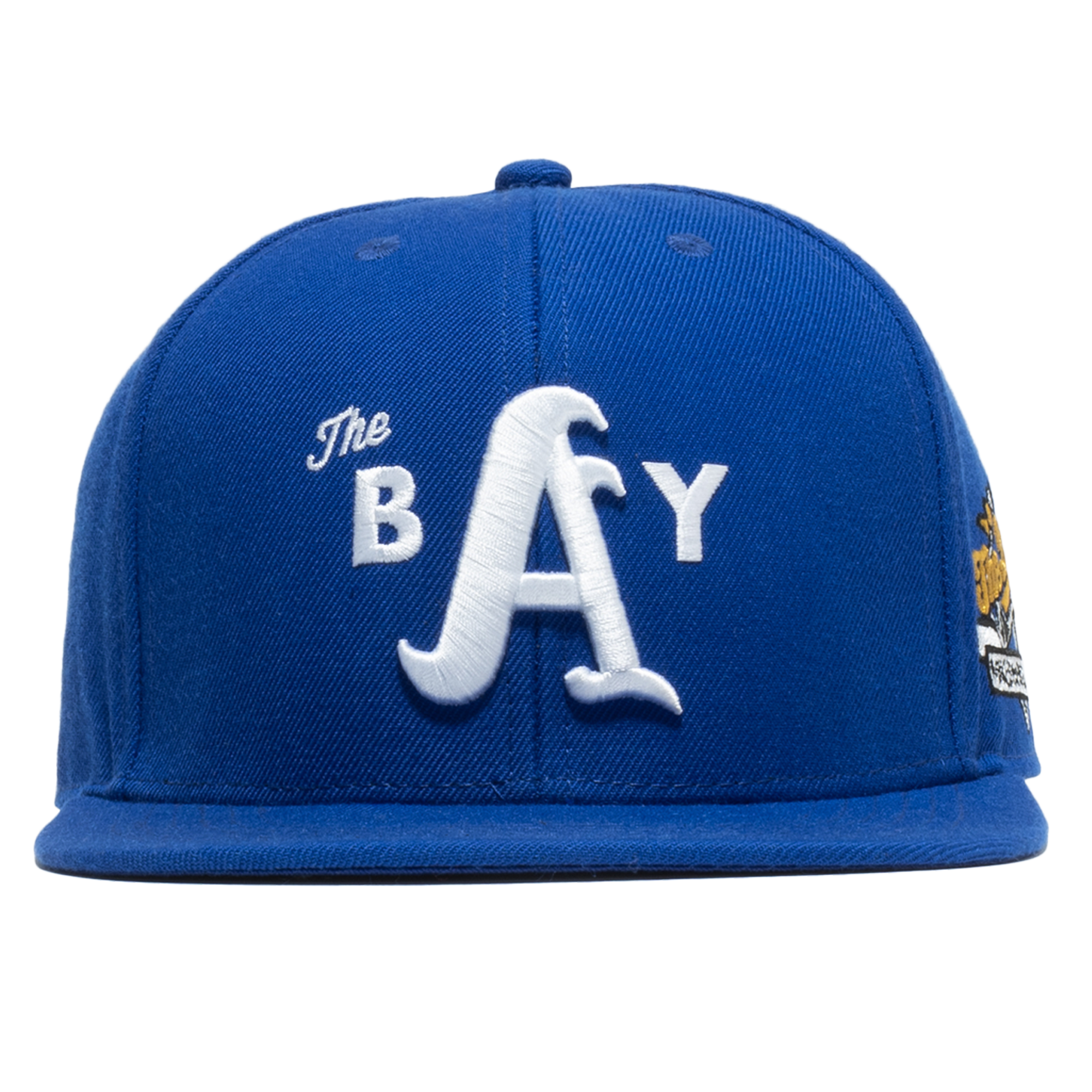 Front view of a Royal blue hat with 3D white embroidered The Bay logo on the crown and blue square flat bill. 