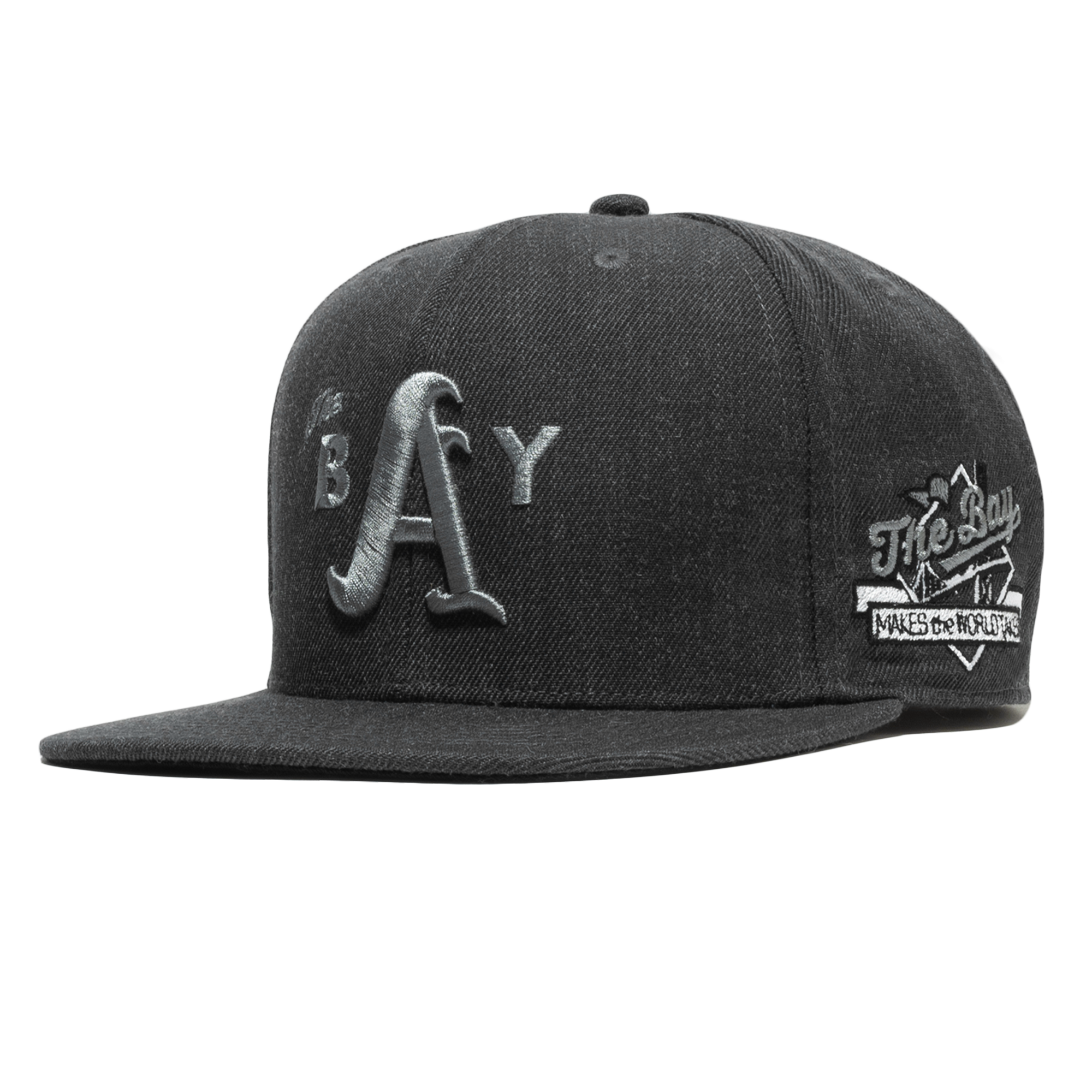 Side-angled front view of a Charcoalhat with 3D grey embroidered The Bay logo on the crown & The Bay Makes, The World Takes detail on the wearer’s left side. 