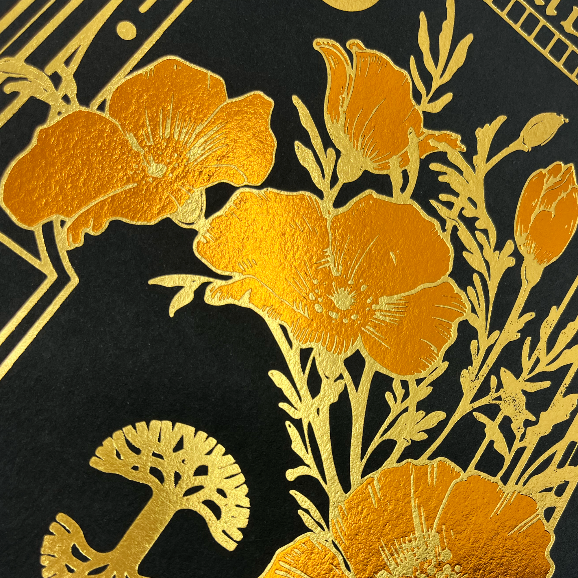 Detailed close-up of best-selling Oaklandish Blossom graphic on a black and gold poster.