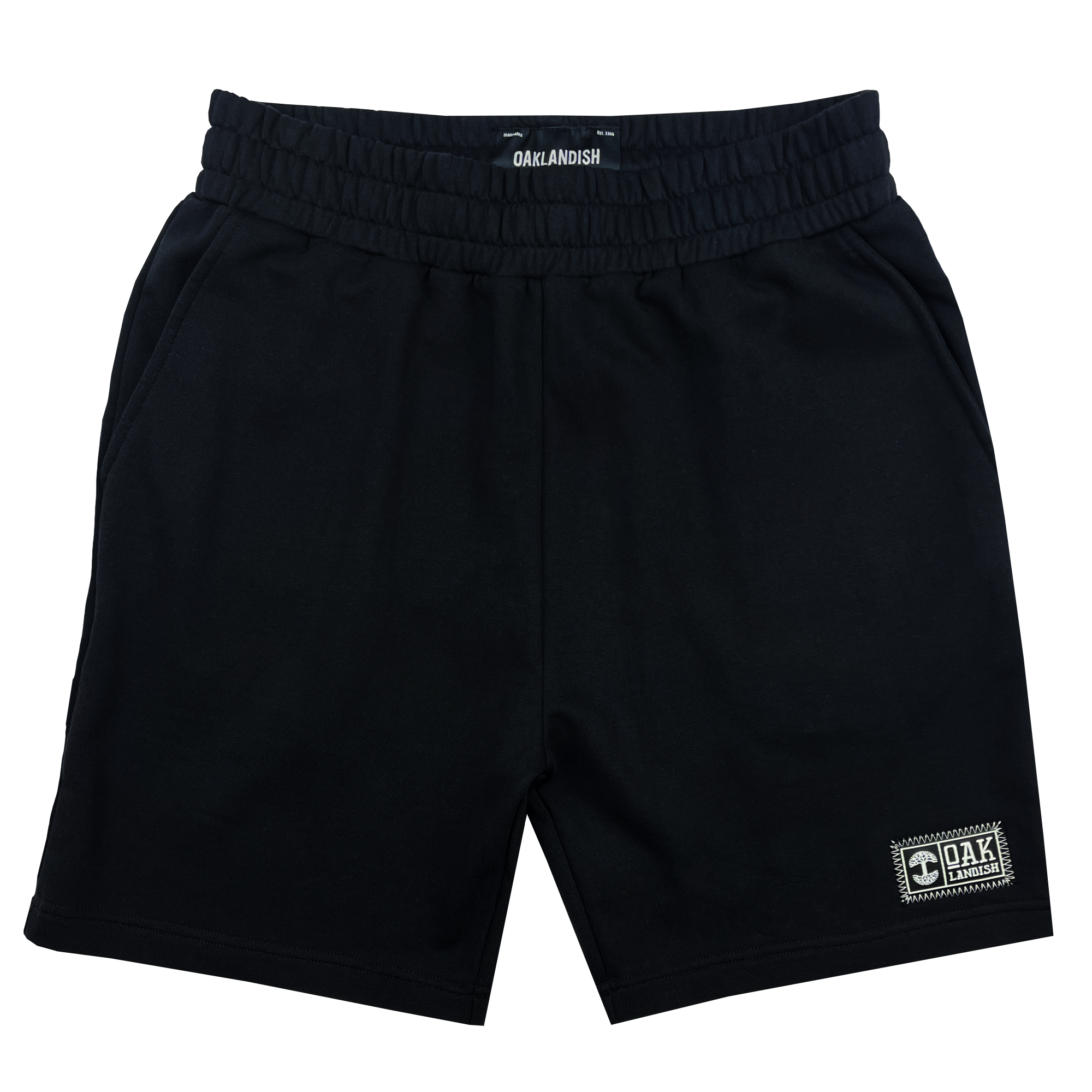  Front view of black fleece shorts with embroidered Oaklandish woven label on wearer's left leg hem.