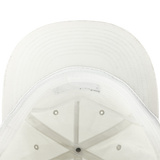 Inside crown of ecru nylon snapback hat.