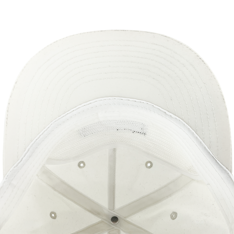 Inside crown of ecru nylon snapback hat.