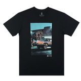 Image of Armando’s lowrider car parked in front of a Nipsey Hussle mural on the chest of a black Oaklandish t-shirt.
