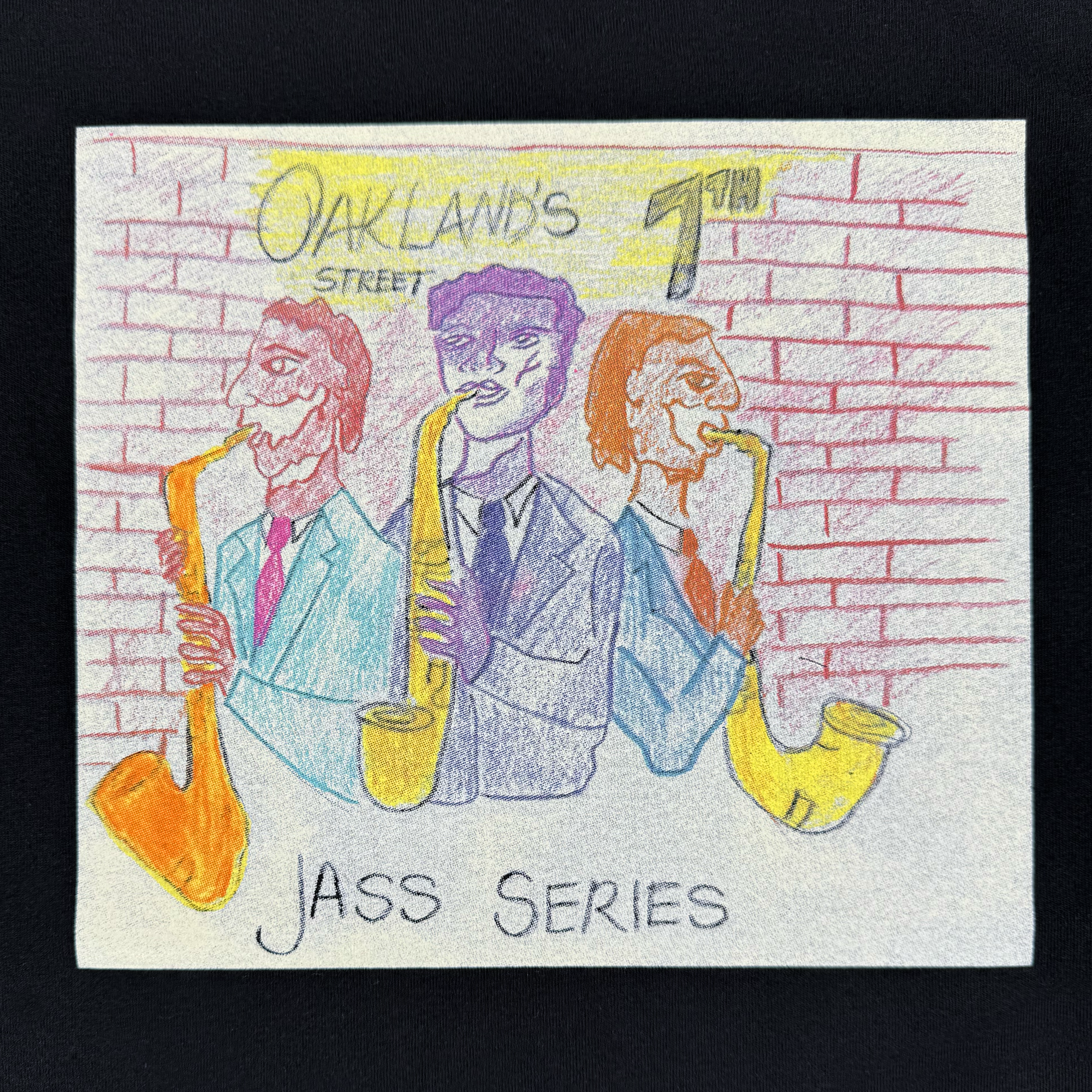 The Oaklandish 7th St. Players Tee features a vibrant print of three men in suits playing saxophones before a brick wall, with "Oakland's 7th Street" above and "Jazz Series" below in bold red, blue, yellow, and purple colors.