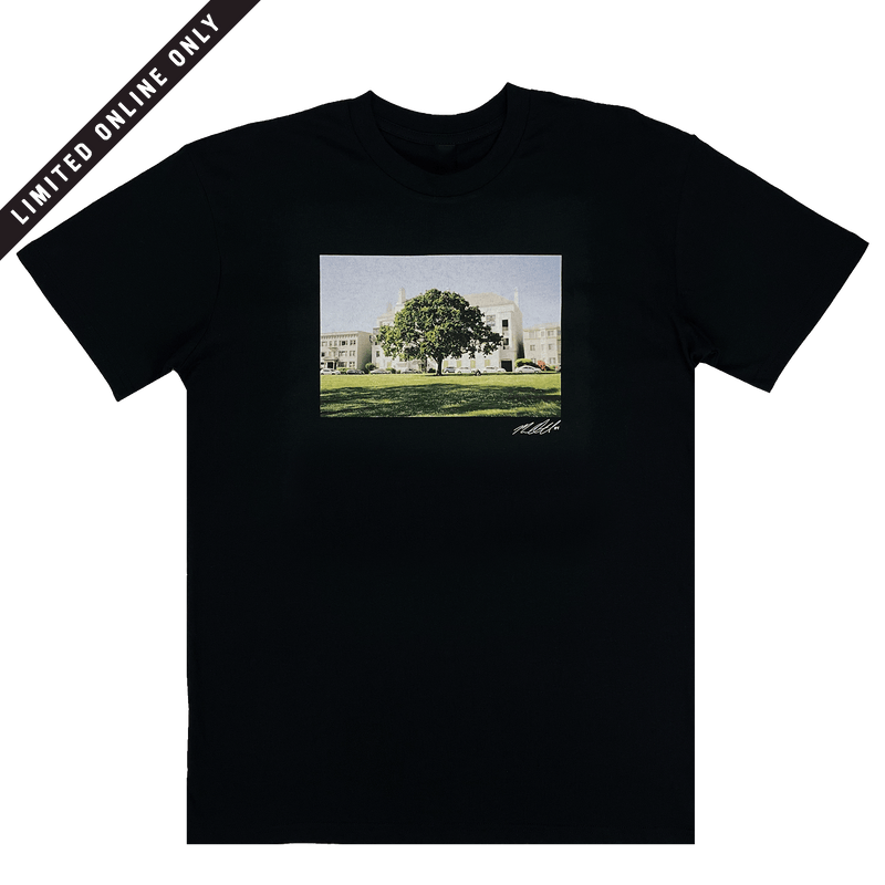 Black t-shirt with signed photographic image of a tree with a building behind and limited edition banner.
