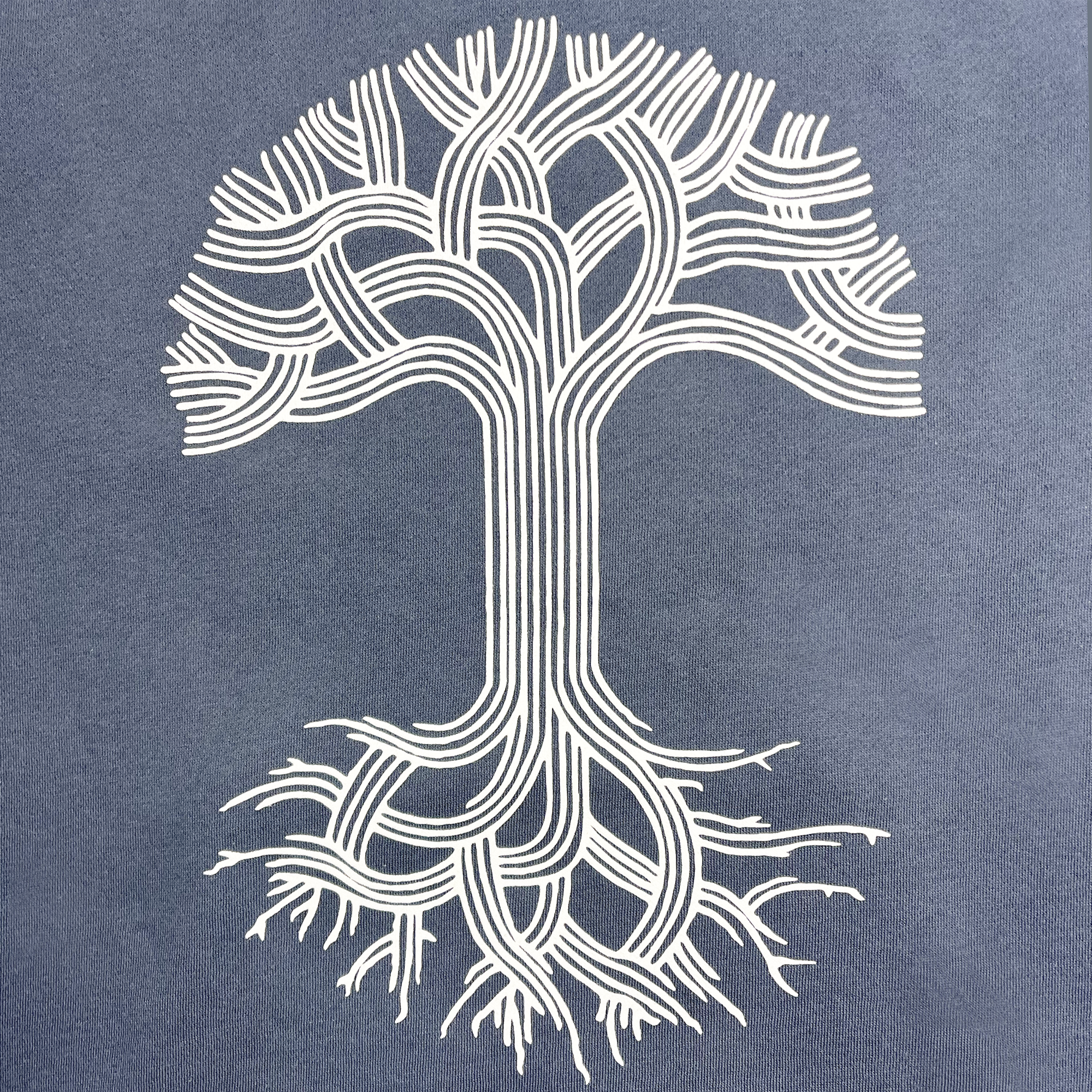 The Oaklandish Classic Hoodie from Oaklandish features a stylized white tree illustration on a storm blue background. The tree consists of an intricate pattern of interconnected, parallel lines forming symmetrical branches and roots, resulting in an elegantly complex design. This minimalist representation on the pullover hoodie embodies Oakland pride through its organic flow and interconnectedness.