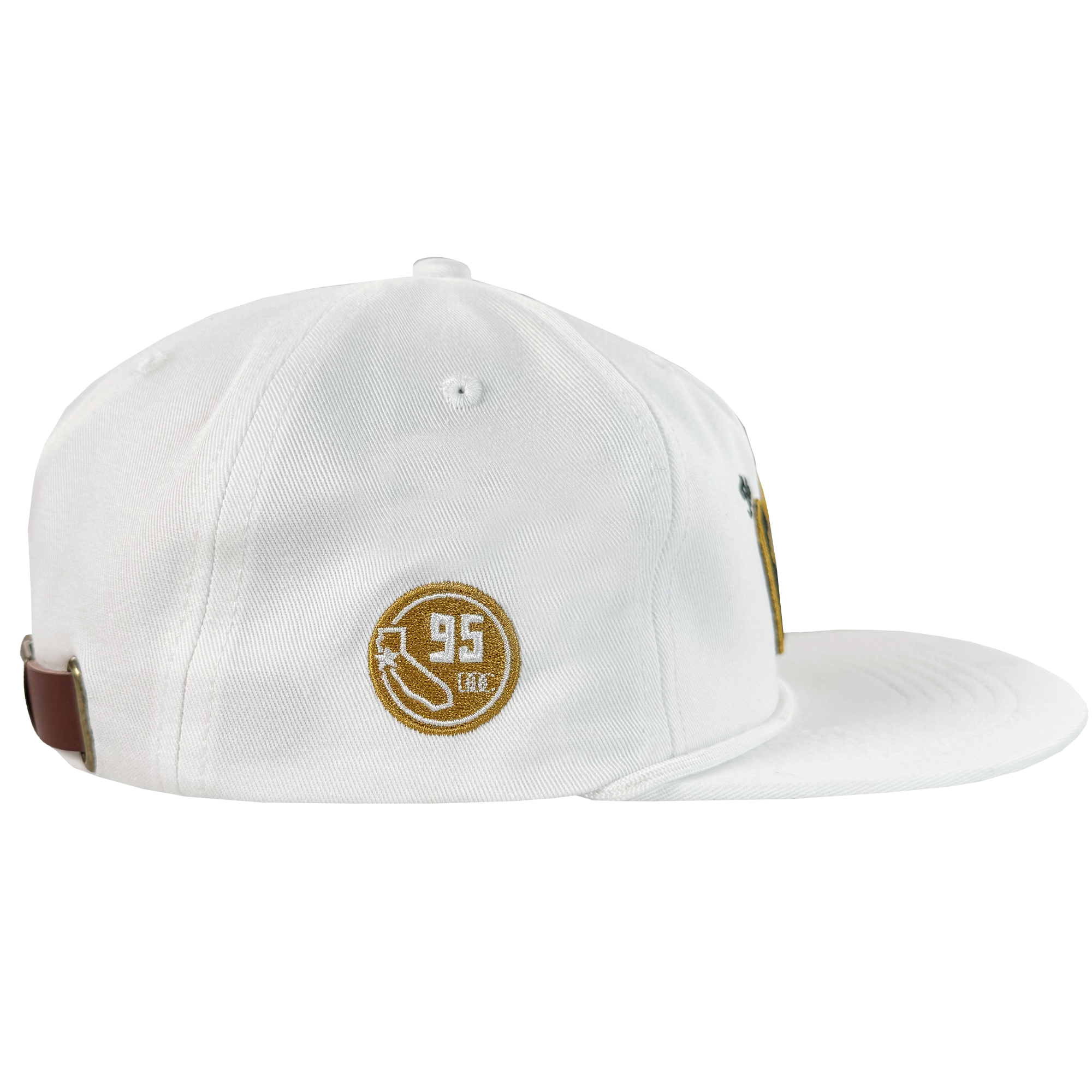 The Bay Area 5 Panel By DOC by Oaklandish is a white, unstructured 5-panel strap back hat with brown and gold embroidery—circle, arrow, “95,” and “LEG.”—stitched eyelets, and a brown back strap, displayed on a plain white background.