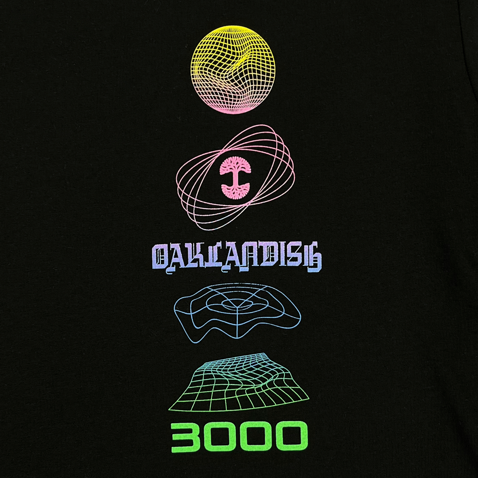 Close-up of neon full-color futuristic graphics with Oaklandish tree logo on the front chest of a black long-sleeve t-shirt.