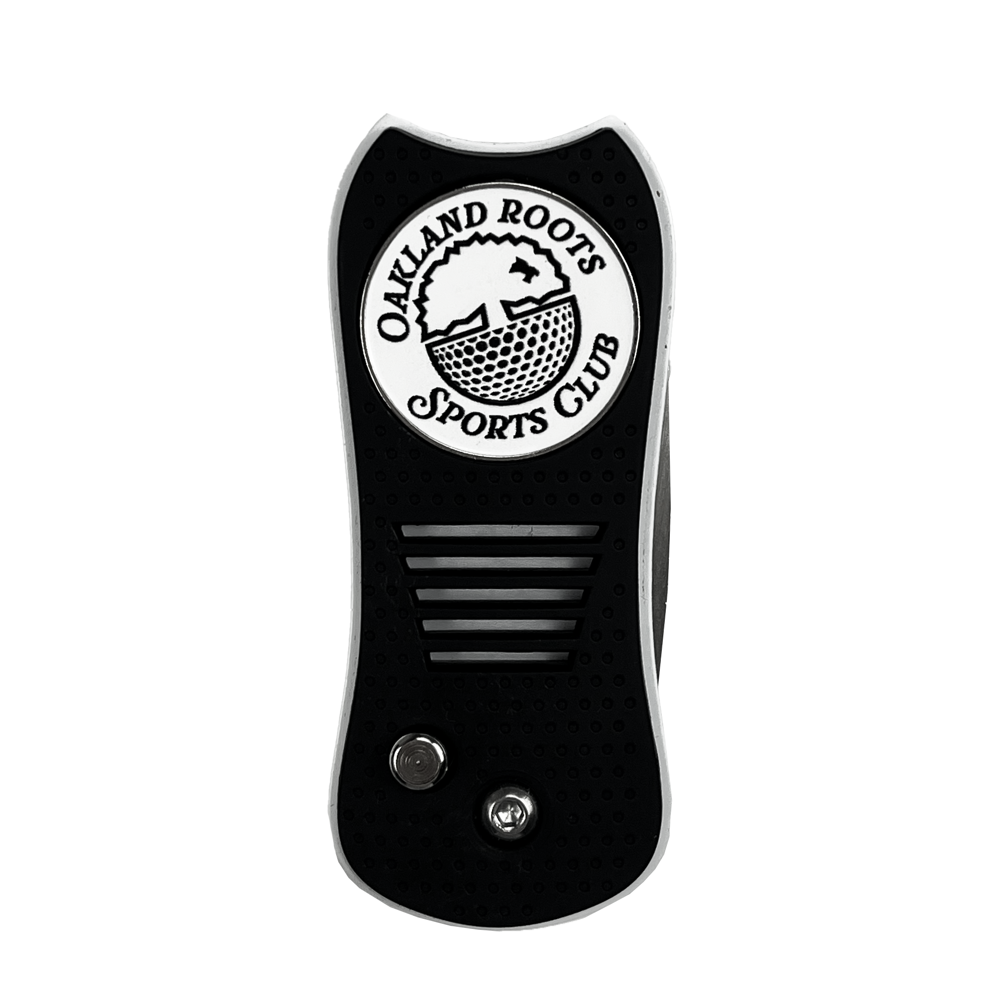 The image depicts the sole of a shoe adorned with a striking black and white design. At the heel, a logo for "Oakland Roots SC" is prominently displayed, featuring a tree above the text in an Oaklandish style. The sole boasts two metallic circular elements and horizontal grooves designed for traction.