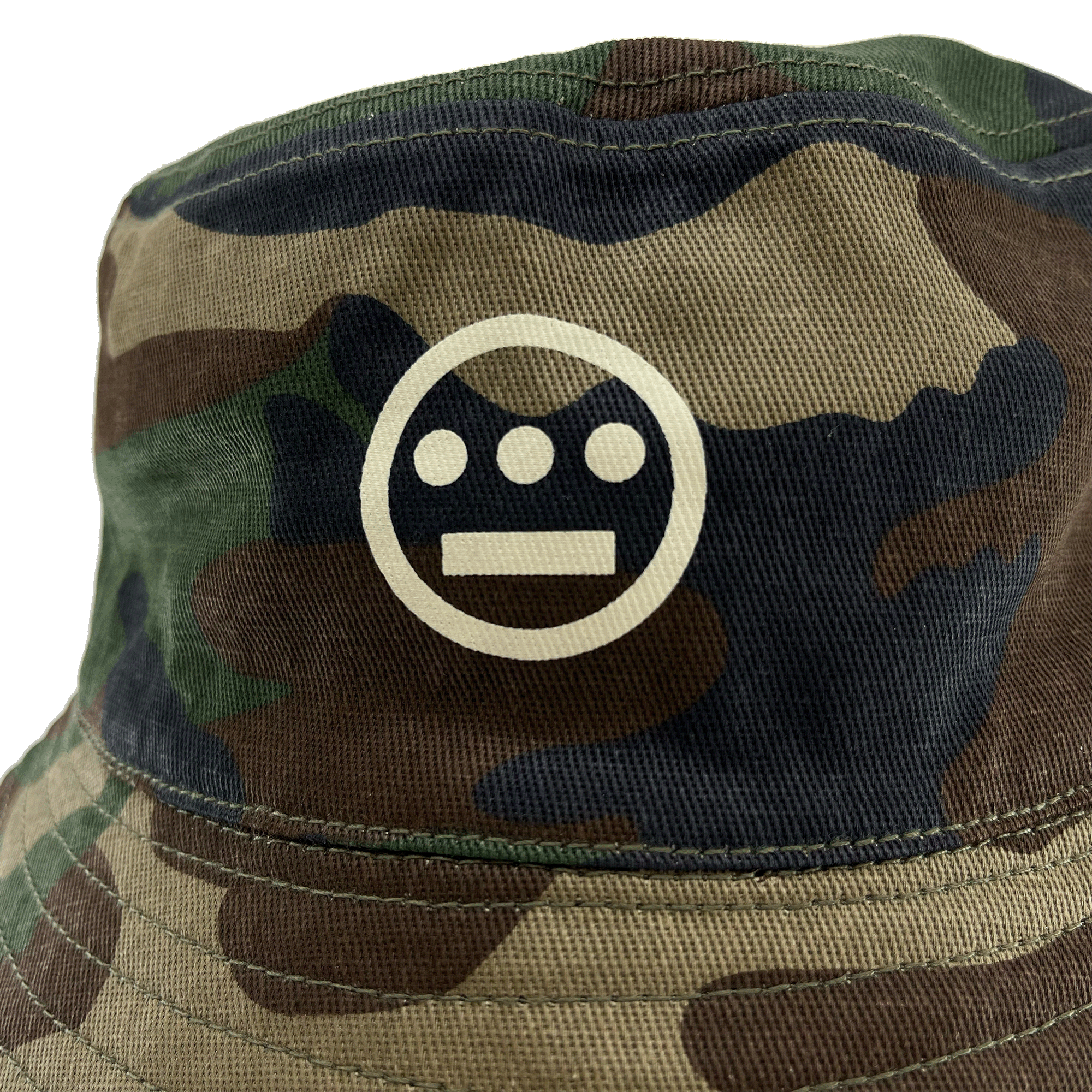 Close-up of Hieroglyphics Hip Hop Crew logo on the front crown of a Woodlands Camo bucket hat. 