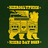 Close-up of yellow Hieroglyphics Hiero Day 2023 graphic on a green t-shirt.