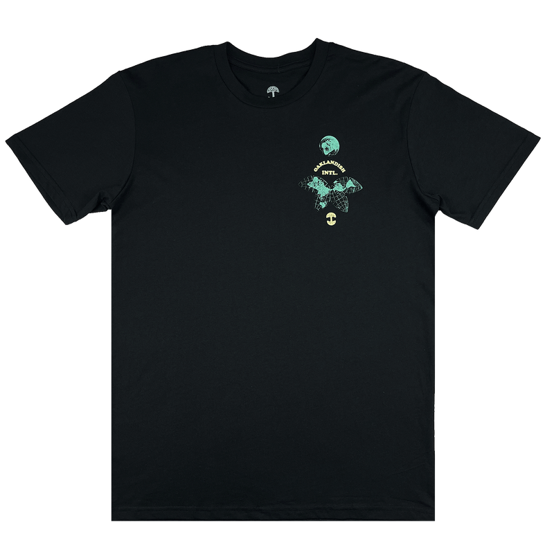 The front side of a black t-shirt with small Oakland International graphic and Oaklandish tree logo on the upper chest.