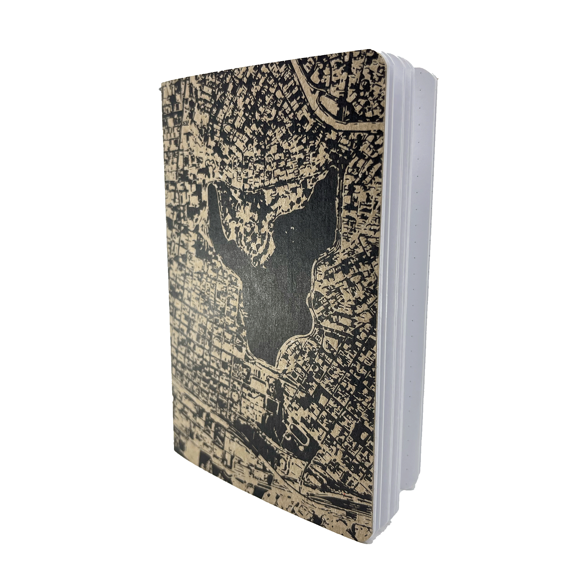 The Aerial Map Mini Notebook by Never Elsewhere features a letterpress cover design that showcases a detailed black and beige map of an urban area, complete with a prominent central lake or body of water. The notebook is depicted standing upright, slightly open on the right side to reveal lightly lined pages inside.