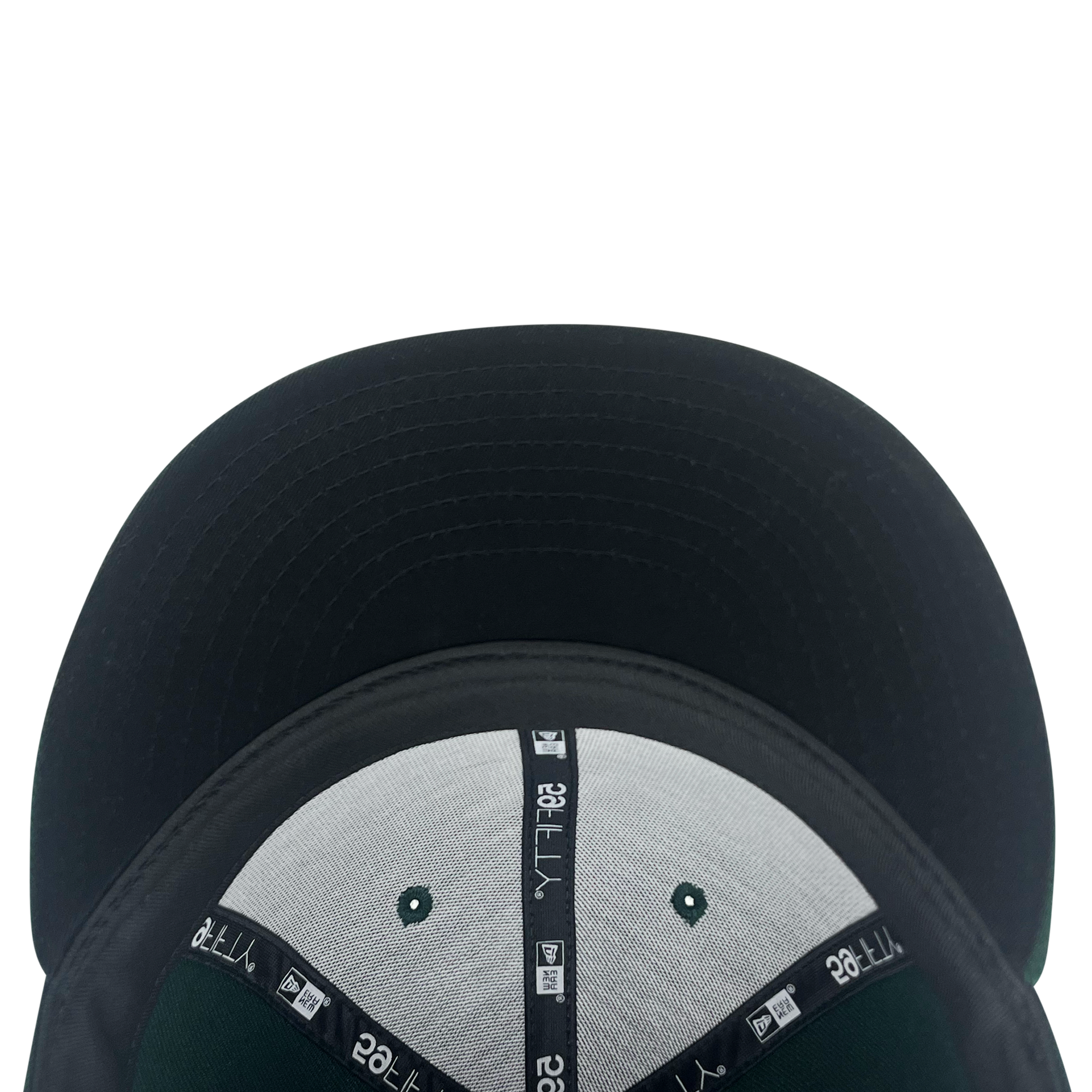 Inside and bill view of forest green 59fifty fitted hat with Los Bravos logo.