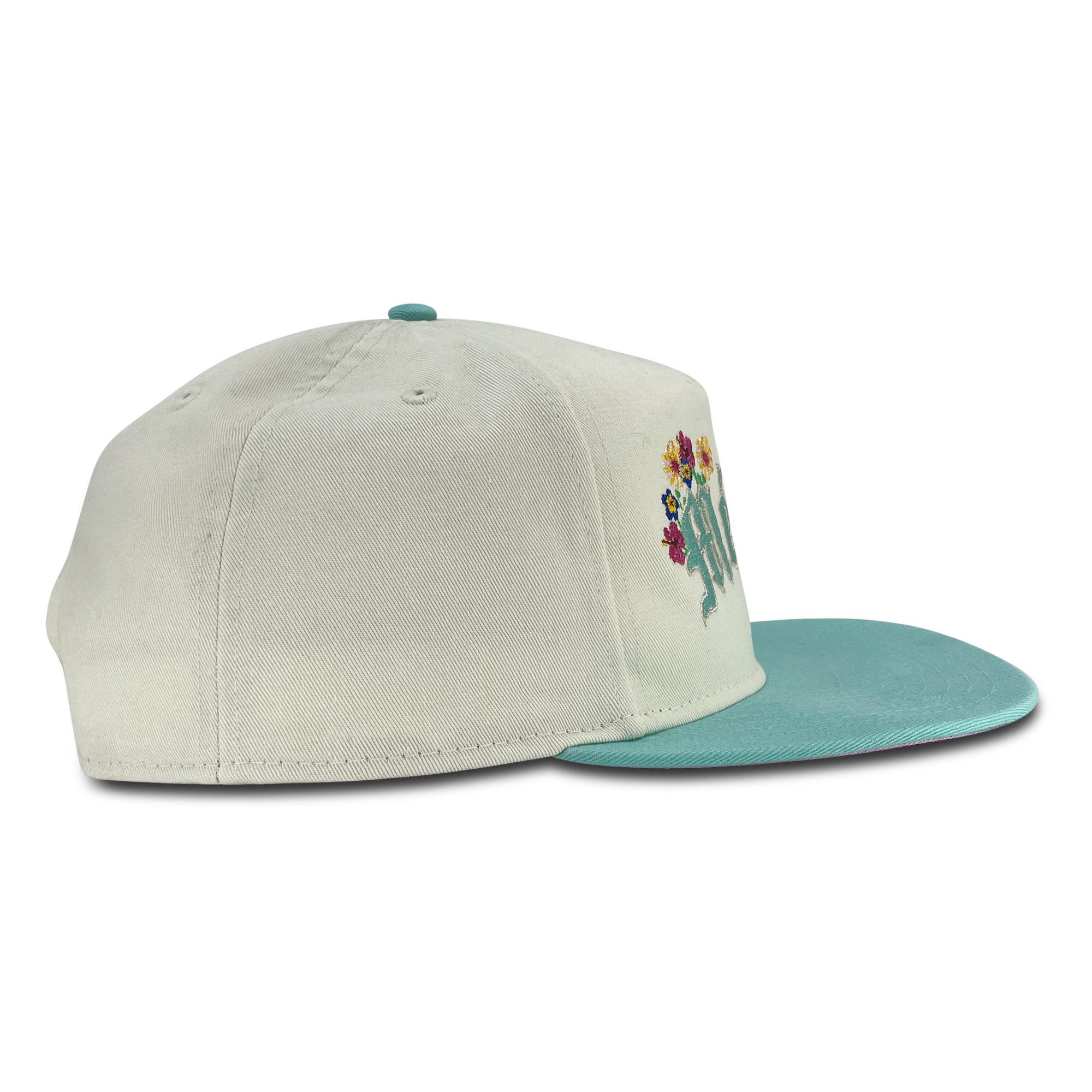 Right side view of cream New Era golfer hat with embroidered Mexico&  floral design.