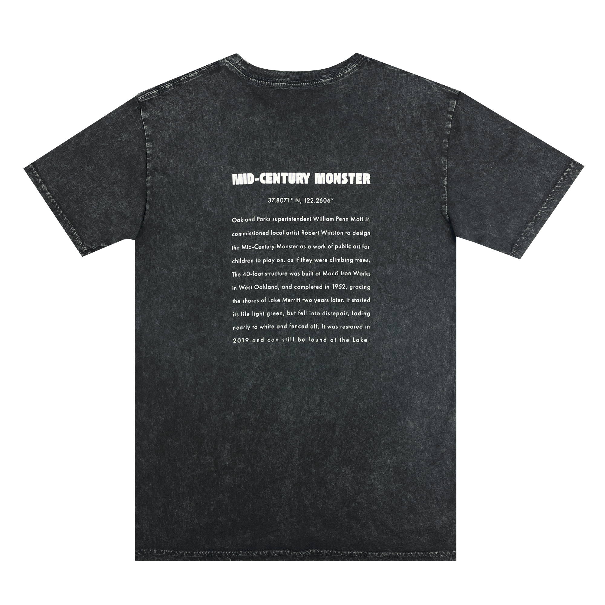 The backside of a black stone-colored t-shirt with long-form text explaining the history of the mid-century monster structure at Oaklands Marci Iron Works.