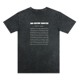 The backside of a black stone-colored t-shirt with long-form text explaining the history of the mid-century monster structure at Oaklands Marci Iron Works.